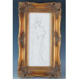 A modern faux marble plaque depicting a Neo-classical scene of Psyche and Cupid, contained in a gilt