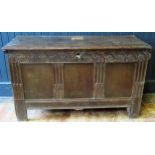 A late 17th/early 18th century oak coffer of panelled construction, the hinged lid with a moulded