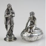 A sterling silver model of the "The Little Mermaid", seated on her rock 5.5cm high, together with