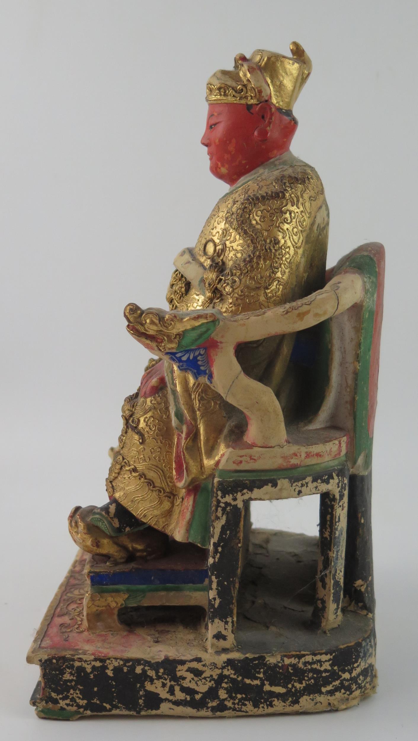 A late 19th century polychrome carved wooden figure of a seated emperor, with gilded decoration, - Image 7 of 8
