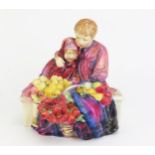 A Doulton figure group HN 1342 Flower Seller's Children, 20cm high.
