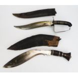 A Malayan Kukri, of traditional design, with wood and leather sheath, together with an Indian dagger