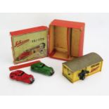 Schuco 15/175 Tinplate Garage Set with No. 3000 Red Clockwork Saloon Car and yellow garage (doors