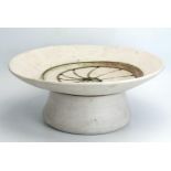 Laurel Keeley (Contemporary) a stoneware pedestal dish, the centre with incised ammonite and pierced