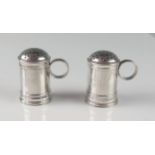 A pair of early 18th century Britannia silver salt dredgers, maker TA or EA, London, date letter