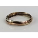 A 9ct Tricolour Gold Triple Interlocking Ring, size O, hallmarked, 2.63g