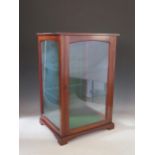 A mahogany table top display cabinet, with glazed panel door and sides, raised on bracket feet, 38cm