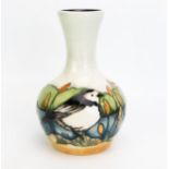 A Moorcroft pottery vase with 'Pied Wagtail' decoration designed by Vicky Lovatt, and released in