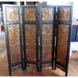 A 20th century Chinese carved hardwood, four fold screen, each fold with two panels depicting