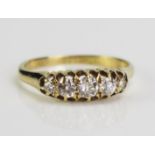An 18ct Gold and Old Cut Diamond Five Stone Ring, largest stone c. 3.8mm, size N.25, 2.7g