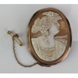 A 9ct Gold Mounted Shell Cameo Brooch decorated with a female bust in profile and with safety chain,