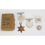 A World War Two trio includes 1939-45 Star, War and Defence Medals and Loyal Service badge.