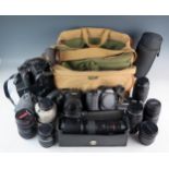 A collection of assorted cameras and accessories, includes Canon EOS camera, EOS-1 camera,