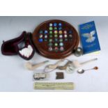 A polished mahogany solitaire board, with marbles, 24cm diameter a Meerschaum pipe with Turks head