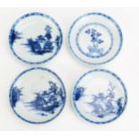 Four Chinese blue and white saucers from the Nanking cargo, each bearing Christies sale labels to