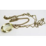 A Large Citrine Pendant in a precious yellow metal surround and on a gilt belcher chain, c.