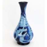 A Moorcroft pottery vase with 'Blue Lagoon' decoration designed by Paul Hilditch, released in