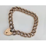 A 9ct Gold Hollow Curb Link Bracelet with chased decoration and 'padlock' clasp, c. 16.65g