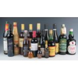 A collection of assorted bottles of spirits wines and liqueurs, including Noilly Prat, Cherry