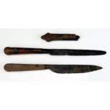 Two medieval knives, found at low tide in the Thames river, together with a wooden knife handle.