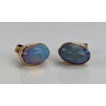 A Pair of Opal Stud Earrings in an unmarked precious yellow metal setting, 9x5mm stones, 1.83g