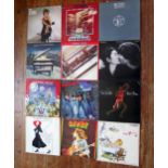 A collection of assorted LP's, artists include bob Marley, Bob Dylan, Tina Turner, Led Zeppelin,