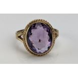 A 9ct Gold and Amethyst Dress Ring, c. 11.5x10mm stone, hallmarked, size L.75, c. 3.81g