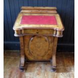 A Victorian walnut and inlaid davenport, the top with fitted compartment for stationery and pens,