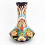 A Moorcroft pottery vase with 'Bukhara' decoration designed by Shirley Hayes, released in 2002,