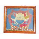 A 19th century sailors wool work picture, the central cartouche with three-masted ship enclosed by