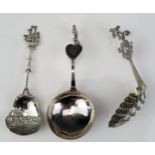 Three Dutch silver caddy spoons, with various shaped bowls, with figural and boat terminals, total