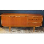A Gentique style teak sideboard, of rectangular outline with a pair of plain field cupboard doors