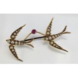 A Twin Swallow Brooch linked by a pink spinel and mounted with untested pearls in an unmarked high