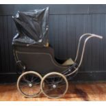 Treasure Cot Co. London, an early 20th century painted wood and canvas pram, with black and lined