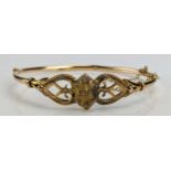 A Victorian 9ct Gold Hinged Bangle, c. 6.56g, boxed. Some dents