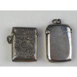 An Edward VII silver vesta case, maker Thomas Heasley, Birmingham, 1904, monogrammed, together