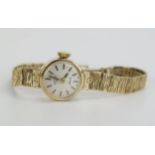 A ROTARY Ladies 9ct Gold Wristwatch on a 9ct gold bracelet, 11.4g nett. Running