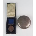 An Edward VII silver circular tobacco box, maker William M Hayes, Birmingham, 1904, inscribed,