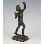 A grand tour style bronze depicting the dancing faun of Pompeii, on a square stepped base, 11.5cm