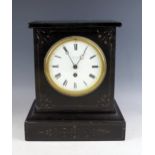 A late Victorian polished slate mantel timepiece, of rectangular outline, with 13cm Roman dial,