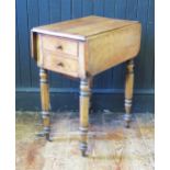 A Victorian walnut sewing table, the top with two hinged leaves, with two short drawers and side