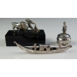 A continental miniature silver model of a bullfighter and bull, mounted on a rectangular base, a