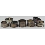 Seven assorted silver napkin rings various makers and dates, total weight of silver 85gms, 2.73ozs