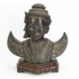 A 20th century Cambodian bronze bust of a dancer, in traditional costume, with inset paste stones,