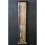 An Admiral Fitzroy barometer, contained in a mahogany case, with mercurial column, mercurial