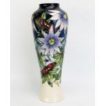 A Moorcroft pottery vase with 'Star of Mikan' decoration designed by Sian Leeper, released in