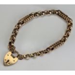An Unmarked Precious Yellow Metal Bracelet with 9ct gold 'padlock' clasp, tests as 9ct on KEE, c.