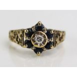 A 9ct Gold, Sapphire and Diamond Cluster Ring, 11mm head, size N.5, 3.4g