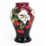 A Moorcroft pottery vase with 'Cherry Blossom' decoration designed by Nicola Slaney, released in