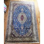 A Nain rug, the ivory field with powder blue cartouche and central pole medallion, ivory floral